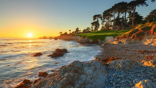Golden hour coastal landscape with rocky shoreline framing sunset.