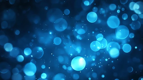Abstract blue bokeh background with glowing light circles.