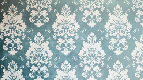 Vintage damask wallpaper in soft teal and ivory tones.