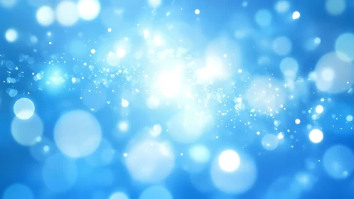 Bright blue bokeh abstract background with glowing light effects.