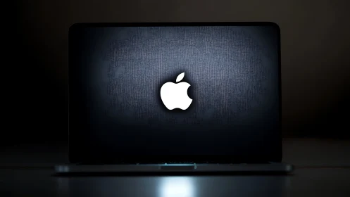 Sleek glowing laptop inviting quiet moments of creativity.