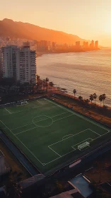 Urban coastal football pitch is viewed from elevated perspective