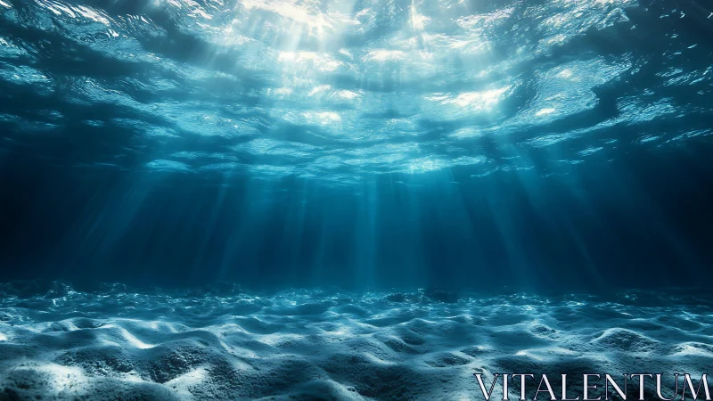 Subsurface ocean view with light beams and sandy seafloor.