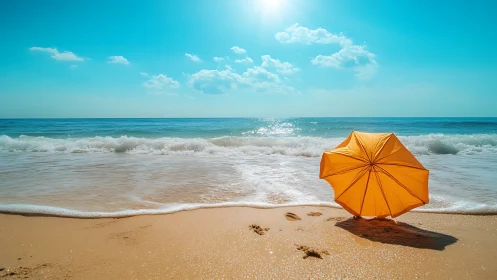 Yellow umbrella on bright sandy beach under midday sun.
