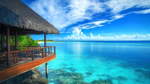 Sunlit overwater hideaway beside glassy turquoise lagoon.