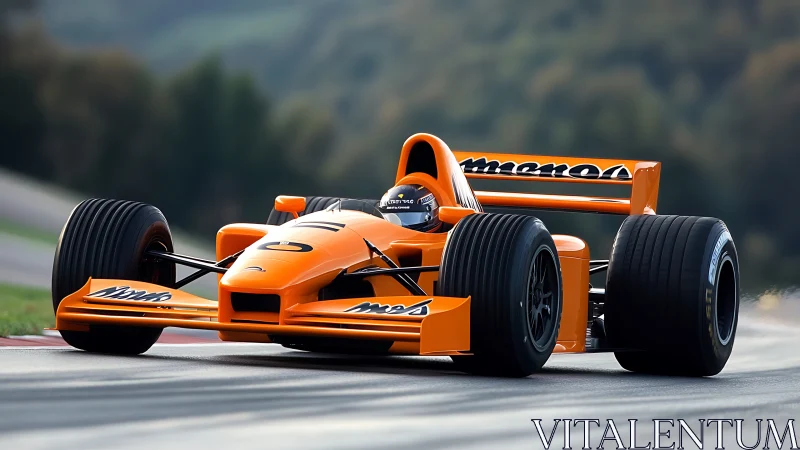Orange open-wheel race car on asphalt circuit corner.
