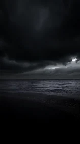 Storm-laden horizon over dark minimalist seascape panorama.