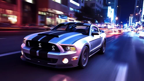 Silver sports coupe on illuminated urban street at night.