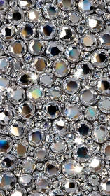 Closeup view of clustered silver rhinestone gems surface