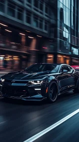 Black performance coupe moving through wet city street at night.
