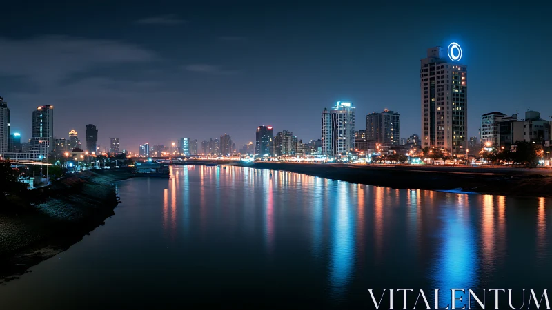 Neon riverfront skyline under deep blue nocturnal glow.