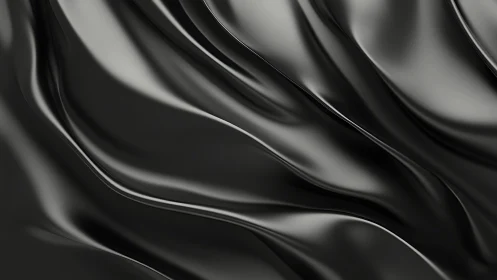 Black metallic surface with folded wave-like contours.