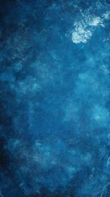 Textured deep blue abstract painted background surface.