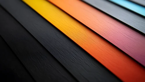 Oblique textured color panels with warm gradient bands on black