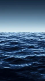 Open ocean surface under clear gradient sky at dusk.