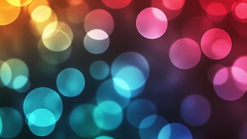 Colorful bokeh circles on dark abstract blurred background.