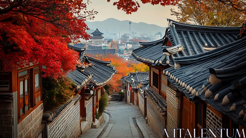 Traditional Korean alley with tiled roofs in autumn foliage.