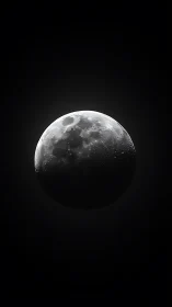 Moon in stark monochrome against deep black void.