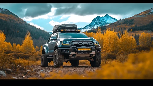 Bold overland truck resting beneath golden mountain passes.