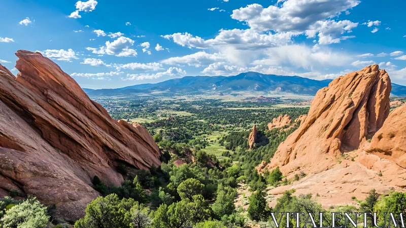 Sunlit red rock canyon opening toward peaceful distant peaks.