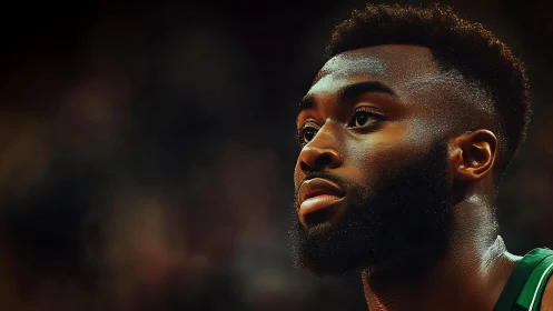 Basketball portrait under dramatic arena bokeh lighting.