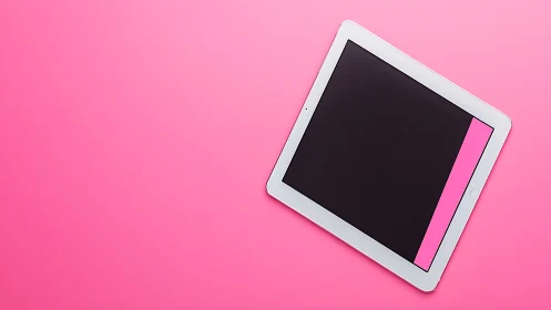 White tablet device with magenta stripe positioned on vibrant pink background at 45 degrees