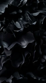 Dark satin ruffles unfold in an abstract floral cascade.