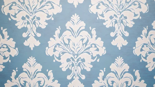 Blue background with white damask style ornamental pattern.