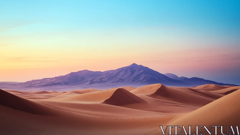 Sunlit sand dunes under pastel desert mountains horizon.