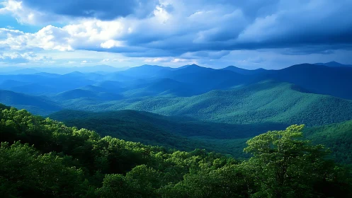 Layered green mountain ridges under heavy blue clouds.