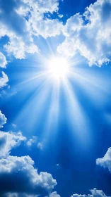 Sunlight radiates through cumulus cloud gaps in blue sky