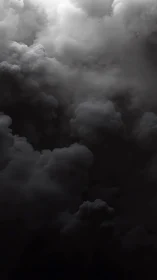 Moody storm clouds gathering in a quiet, dramatic sky.