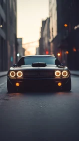 Midnight muscle car poised on empty city street at dusk.