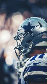Helmeted football player waits in glowing stadium light