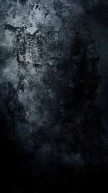Charcoal-stained concrete texture with deep shadow gradients.