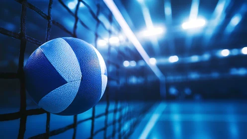 Blue volleyball caught in motion under electric arena lights.