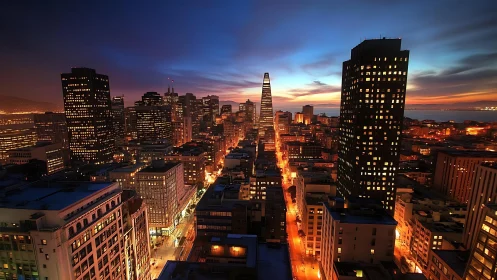 Downtown skyline glows under vivid sunset sky panorama.