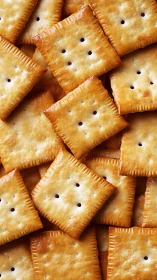 Square crackers with characteristic perforations arranged in overlapping pattern.