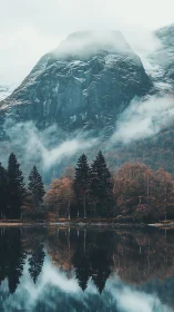 Mist-draped mountain listens quietly to the mirror-still lake
