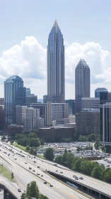 Glass skyscraper cluster dominates bright urban skyline.