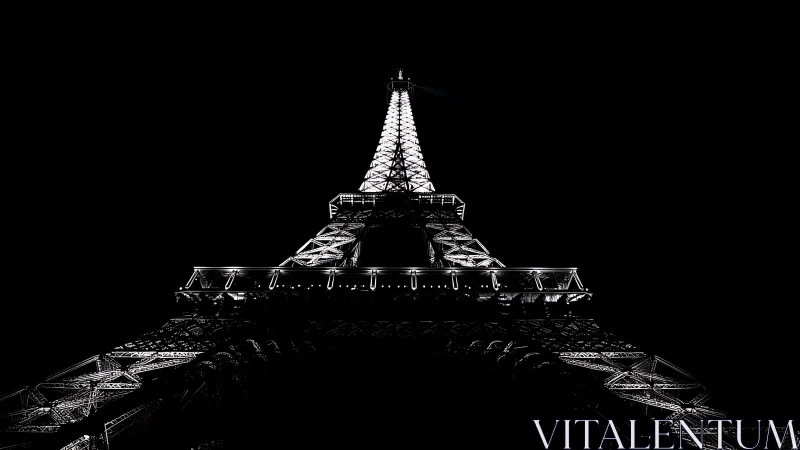 Steel tower structure is illuminated against a black sky