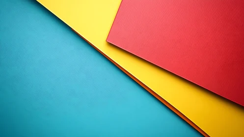 Overlapping red, yellow and teal sheets in diagonal layout.