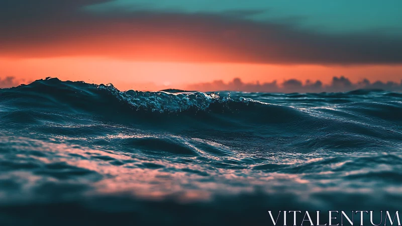 Crimson horizon over teal ocean swells at golden dusk.