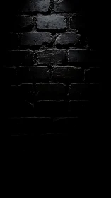 Moody black brick wall glowing softly in the dark.