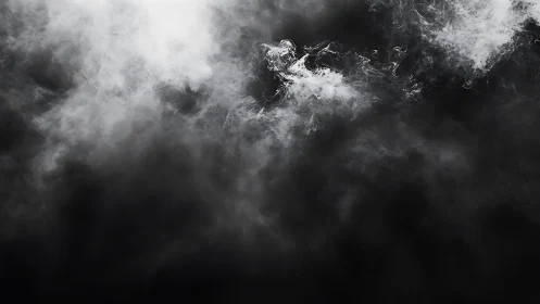 Abstract black and white smoke texture with soft swirling patterns.