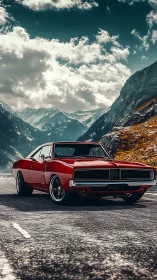 Red classic muscle car on mountain pass roadway.