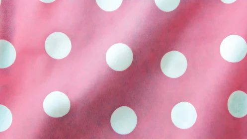 Pink polka dot pattern with three-dimensional spheres.