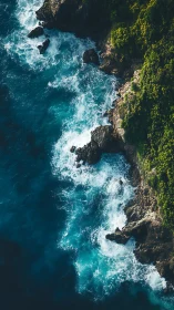 Rocky coastline with turquoise waves and dense green cliffs.