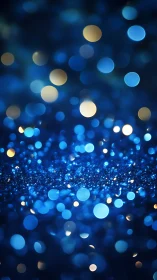 Blue bokeh lights shimmer over glittering abstract field.