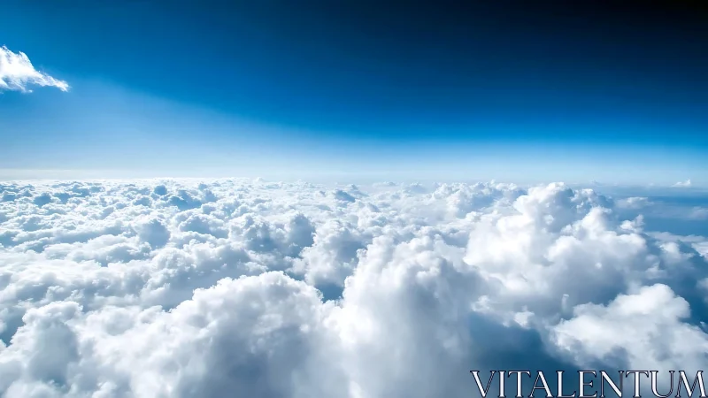 High-altitude cumuliform cloud deck under deep blue troposphere